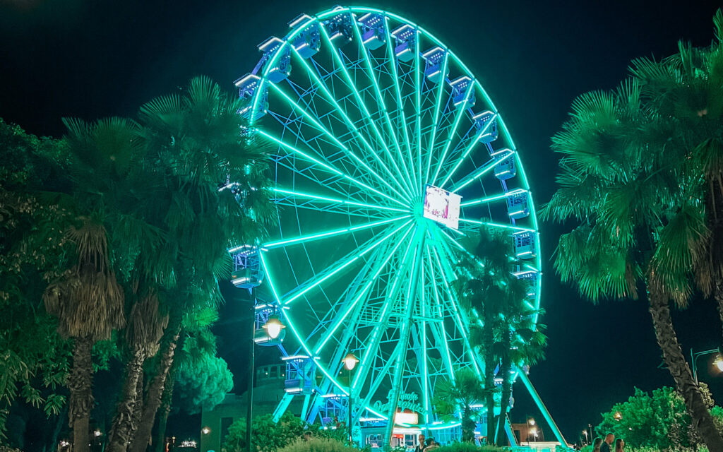 A ferris wheel in Olbia by night
