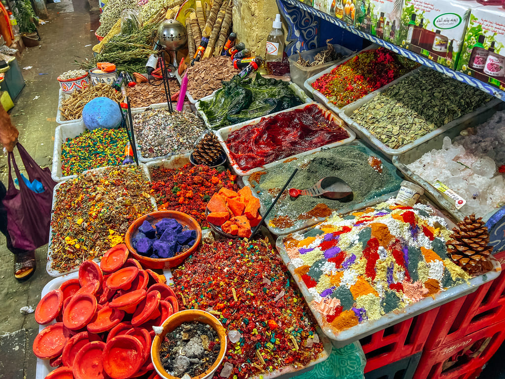 different spices and goods at a market inside the Medina